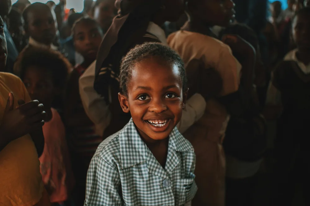 A smiling young boy.